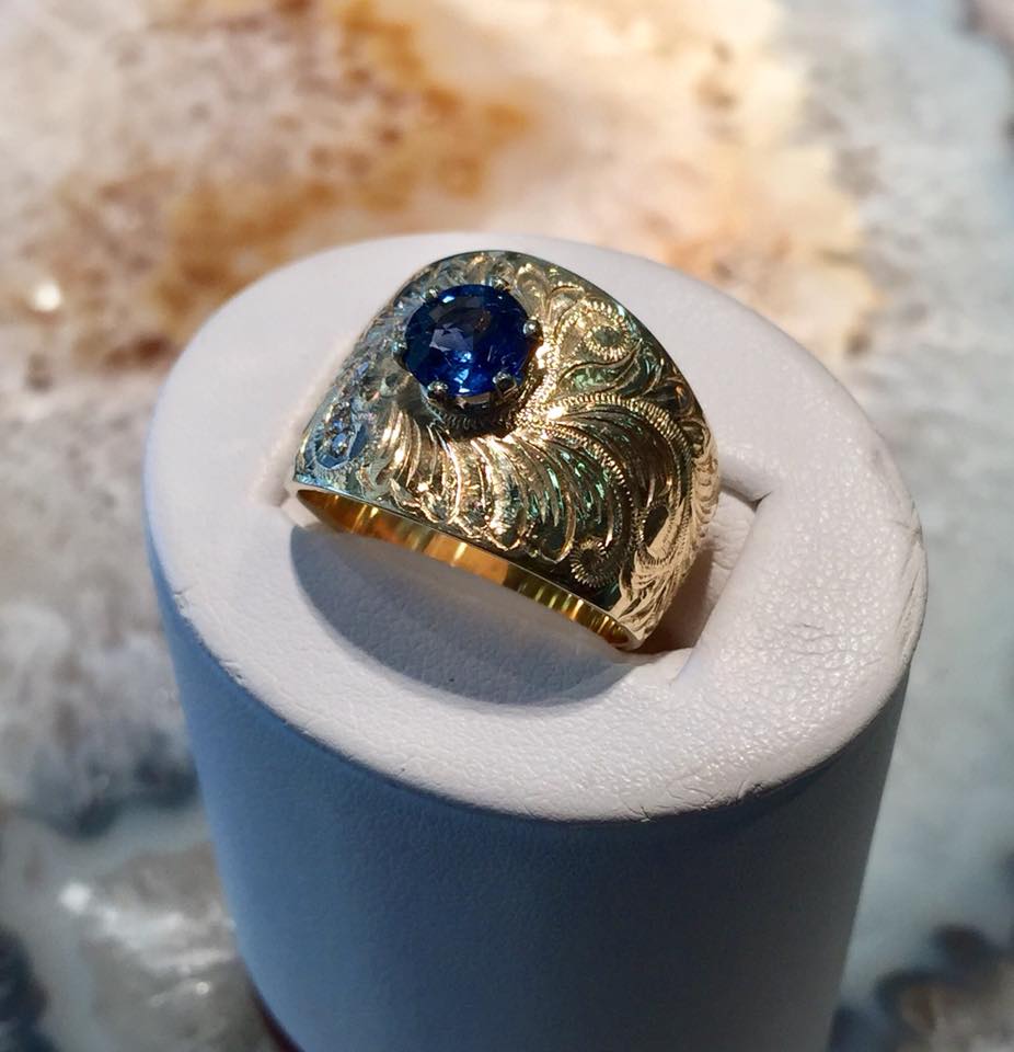 Unique hand engraved gold ring with blue sapphire